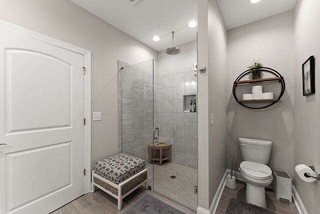 457 Celie Ann Seabolt Rd, Cleveland, GA 30528 - bathroom featuring a shower stall, baseboards, recessed lighting, toilet, and wood finish floors