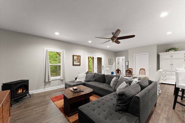457 Celie Ann Seabolt Rd, Cleveland, GA 30528 - living room featuring wood finished floors, ceiling fan, recessed lighting, baseboards, and a wood stove