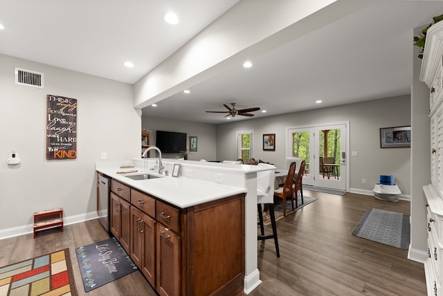 457 Celie Ann Seabolt Rd, Cleveland, GA 30528 - kitchen featuring a sink, a breakfast bar area, open floor plan, a peninsula, and ceiling fan