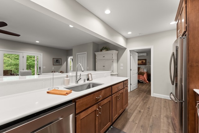 457 Celie Ann Seabolt Rd, Cleveland, GA 30528 - kitchen featuring stainless steel appliances, a sink, ceiling fan, light countertops, and brown cabinets