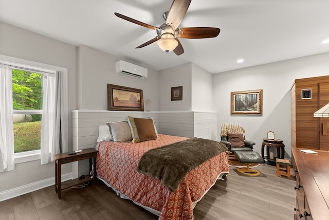 457 Celie Ann Seabolt Rd, Cleveland, GA 30528 - bedroom with wood finished floors, a wall mounted AC, recessed lighting, ceiling fan, and baseboards
