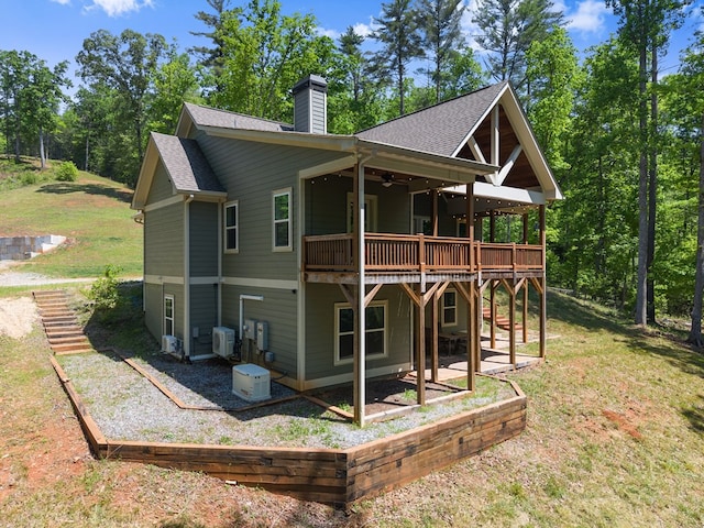 457 Celie Ann Seabolt Rd, Cleveland, GA 30528 - back of property with ceiling fan, a wooden deck, a chimney, a patio area, and a lawn