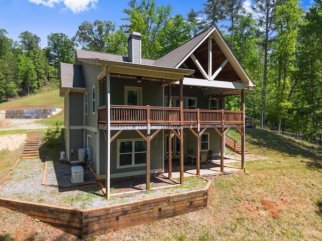 457 Celie Ann Seabolt Rd, Cleveland, GA 30528 - rear view of house with a wooden deck, a chimney, a yard, a patio area, and roof with shingles