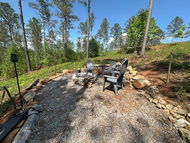 view of yard with an outdoor fire pit