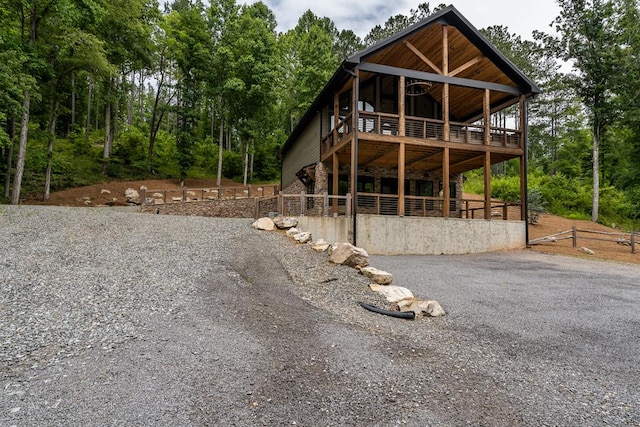 230 High River Lndg, Ellijay, GA 30540 - view of front of home with stone siding, driveway, and a wooden deck