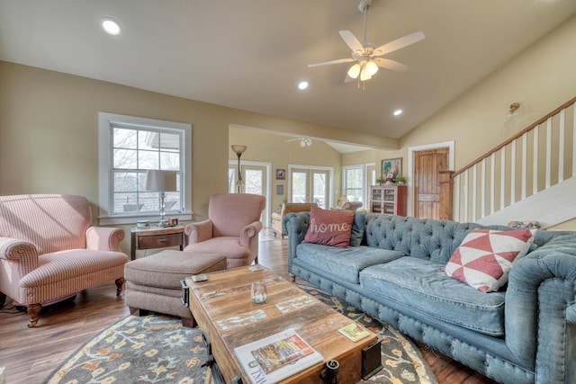 living area featuring a ceiling fan, lofted ceiling, recessed lighting, and wood finished floors