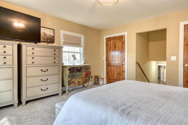 bedroom featuring light colored carpet