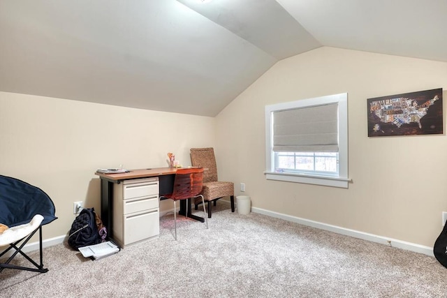 office space featuring lofted ceiling, carpet flooring, and baseboards