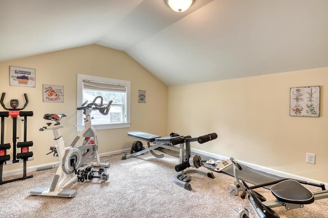 exercise area with lofted ceiling, carpet floors, and baseboards