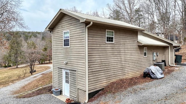 view of property exterior featuring metal roof