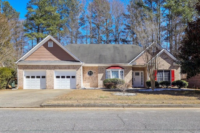 3065 NW Kings Rd, Kennesaw, GA 30144 - view of front of home featuring brick siding, an attached garage, concrete driveway, and a front yard