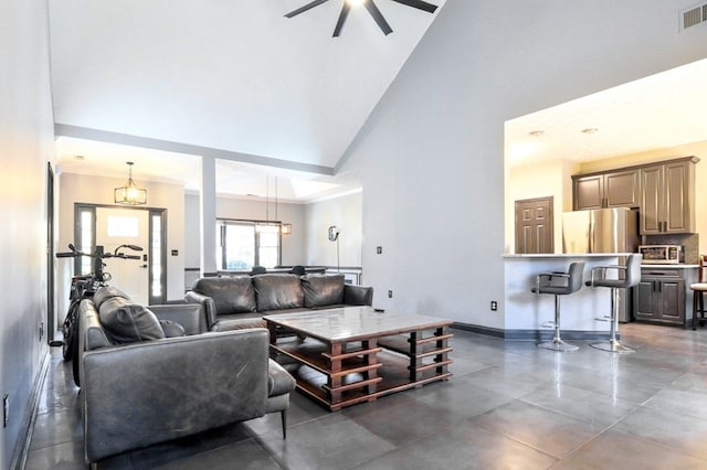 3065 NW Kings Rd, Kennesaw, GA 30144 - living room with high vaulted ceiling, ceiling fan, and baseboards