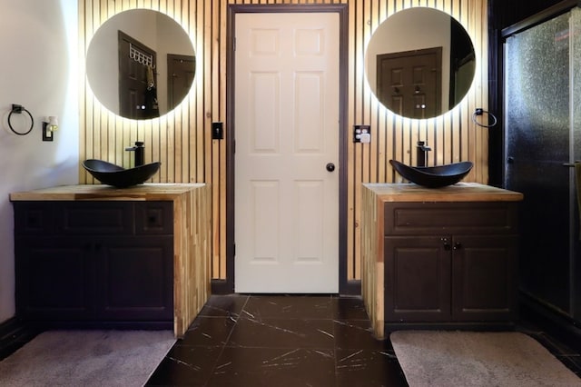 3065 NW Kings Rd, Kennesaw, GA 30144 - full bathroom featuring marble finish flooring and two vanities