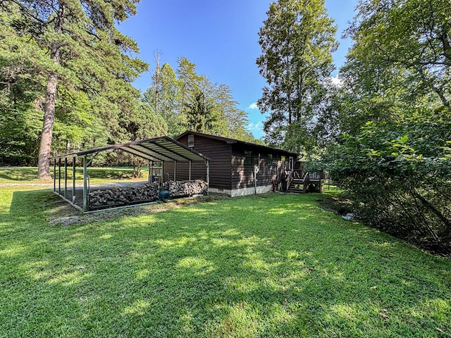 view of yard featuring a wooden deck and a carport