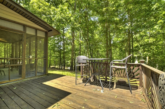wooden terrace with a sunroom