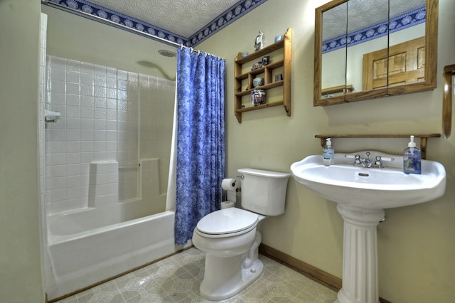 full bathroom with toilet, shower / tub combo with curtain, baseboards, and a textured ceiling