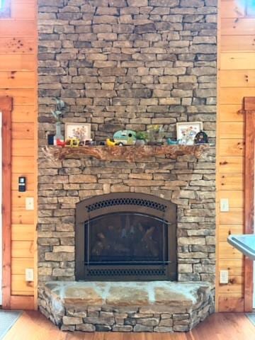 5575 Rainbow Springs Rd, Franklin, NC 28734 - detailed view of wood finished floors, a fireplace, and wooden walls