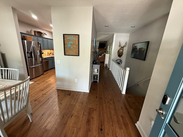 209B N Berrong St, Hiawassee, GA 30546 - hall featuring an upstairs landing, hardwood / wood-style floors, and recessed lighting