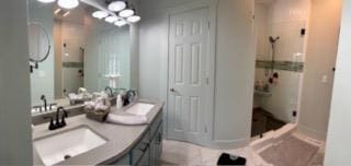 209B N Berrong St, Hiawassee, GA 30546 - bathroom featuring a shower stall and double vanity