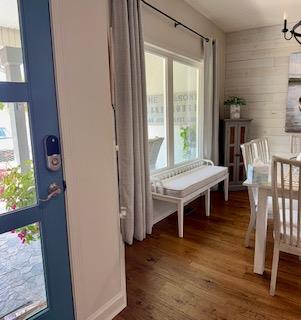 209B N Berrong St, Hiawassee, GA 30546 - entryway with wood finished floors, a chandelier, and wood walls