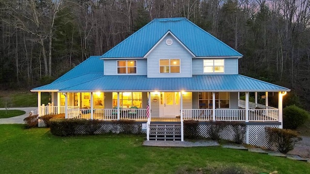 back of property featuring a lawn and a porch