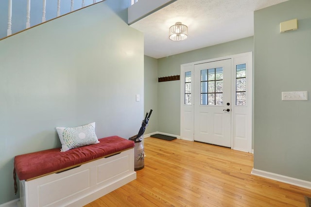 foyer featuring a notable chandelier and hardwood / wood-style flooring