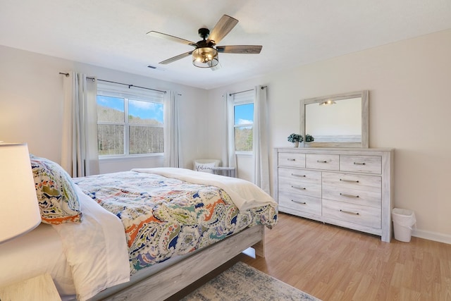 bedroom featuring light hardwood / wood-style flooring and ceiling fan