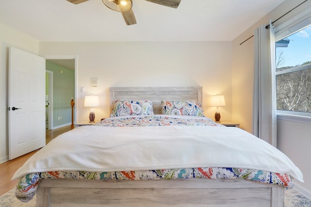 bedroom featuring hardwood / wood-style flooring and ceiling fan