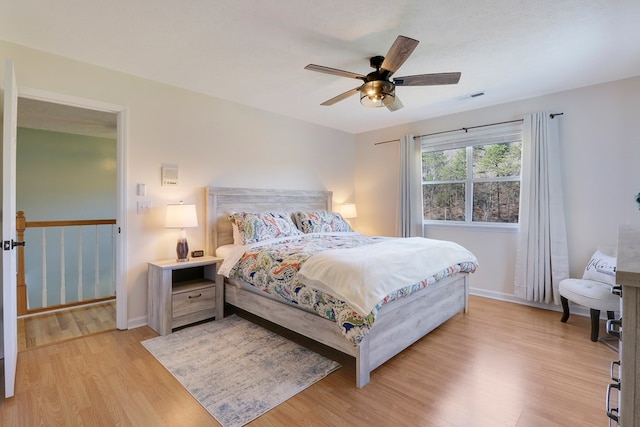 bedroom featuring ceiling fan and light hardwood / wood-style flooring