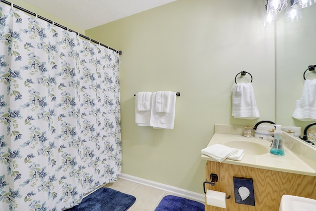 bathroom featuring vanity, a textured ceiling, and tile patterned flooring