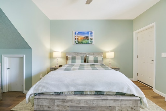 bedroom with ceiling fan and wood-type flooring