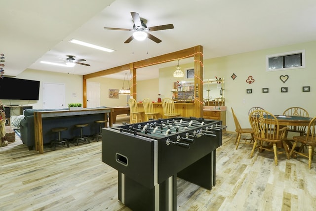 playroom featuring light hardwood / wood-style floors and ceiling fan