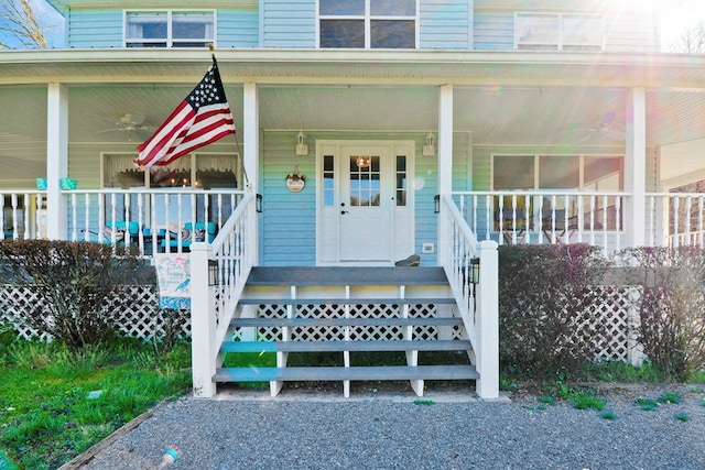 view of exterior entry featuring a porch