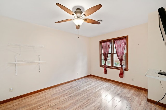 spare room with ceiling fan and light hardwood / wood-style flooring