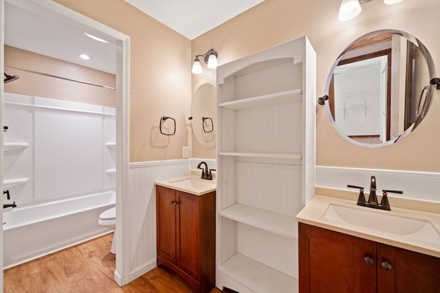 full bathroom featuring toilet, shower / bathing tub combination, vanity, and wood-type flooring