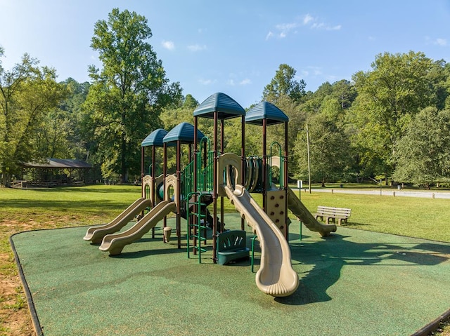 view of playground with a lawn