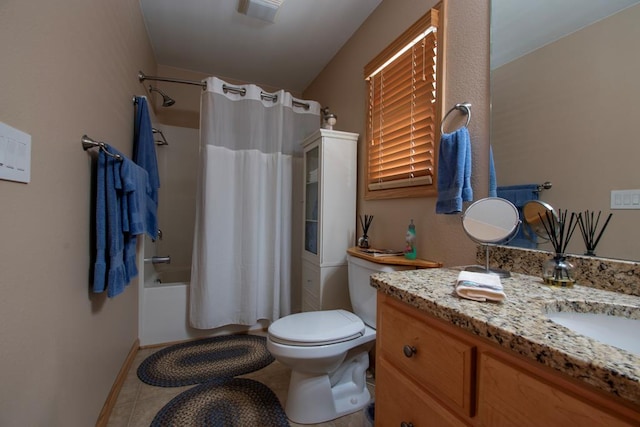 full bathroom featuring tile patterned flooring, vanity, toilet, and shower / tub combo with curtain