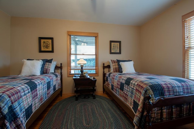 bedroom with dark wood-type flooring