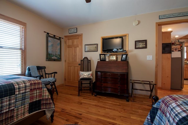 bedroom featuring ceiling fan and light wood-type flooring