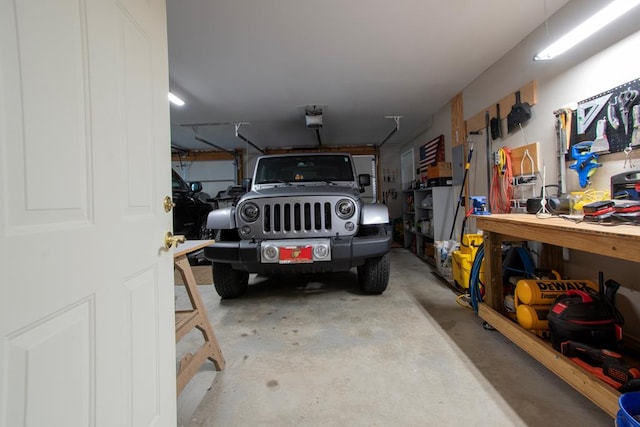 garage featuring a workshop area and a garage door opener