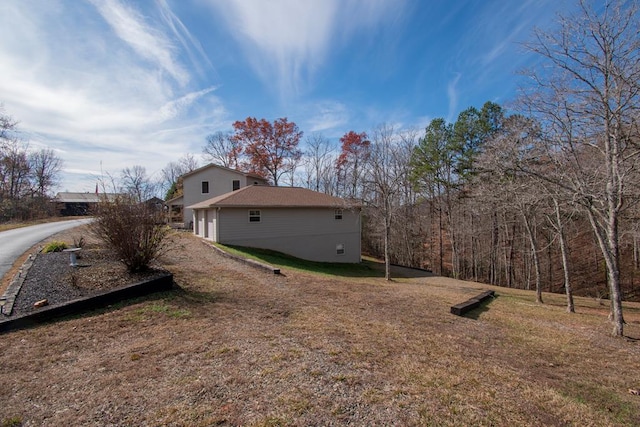 view of home's exterior featuring a yard