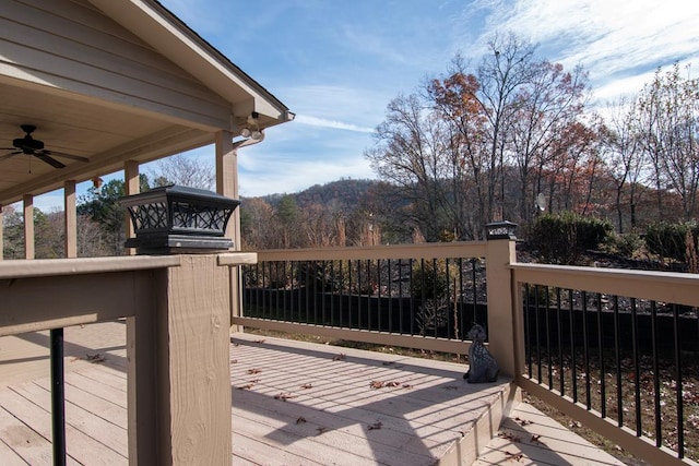 wooden terrace featuring ceiling fan