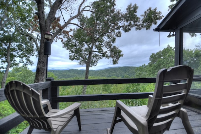 wooden terrace featuring a mountain view