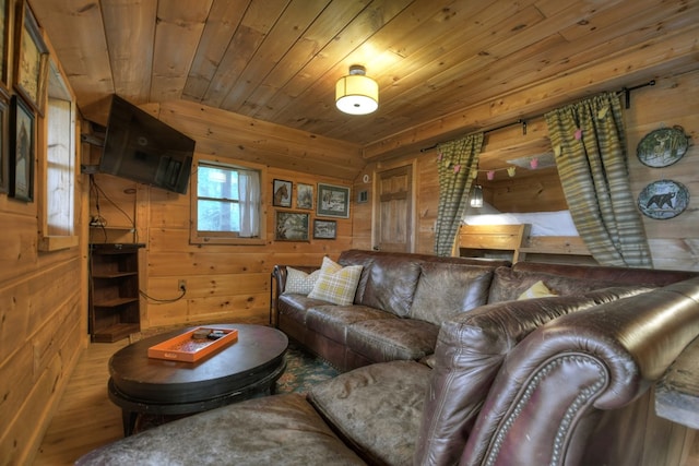 living room with wood ceiling, wooden walls, and hardwood / wood-style flooring