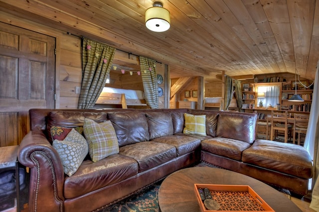 living room with wood ceiling and wood walls