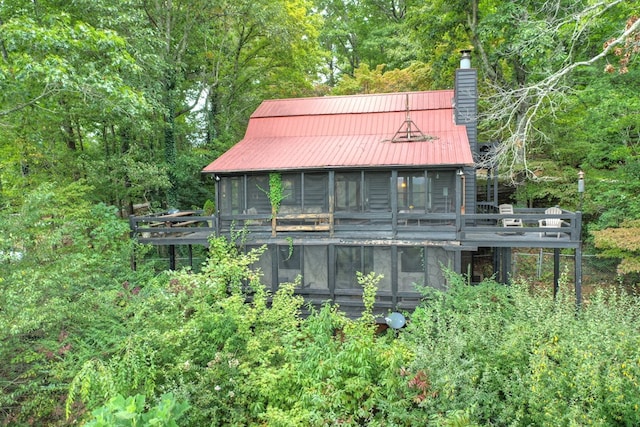 rear view of house with a sunroom