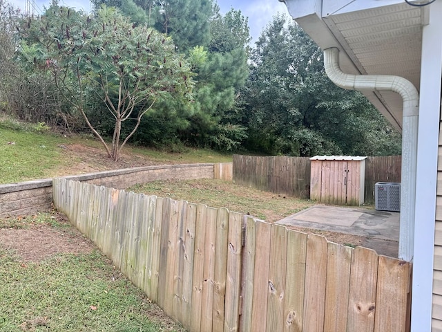 view of yard with central air condition unit and fence private yard