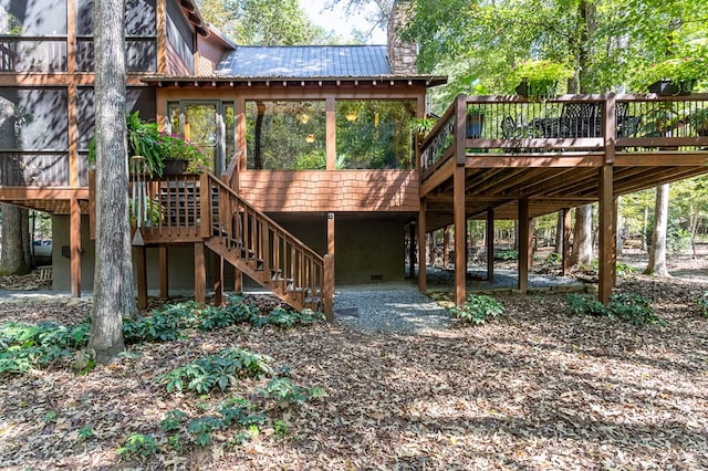 exterior space with a sunroom and a deck