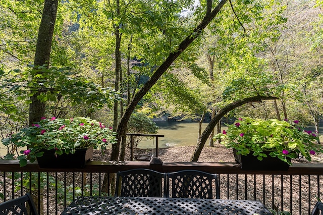 wooden deck featuring a water view