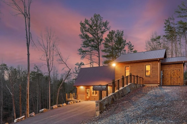 87 Lonesome Dove Path, Blue Ridge, GA 30513 - rustic home with driveway, metal roof, and log veneer siding